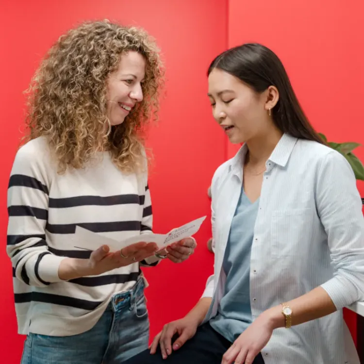 Wall Street English meeting with a member of staff and a student